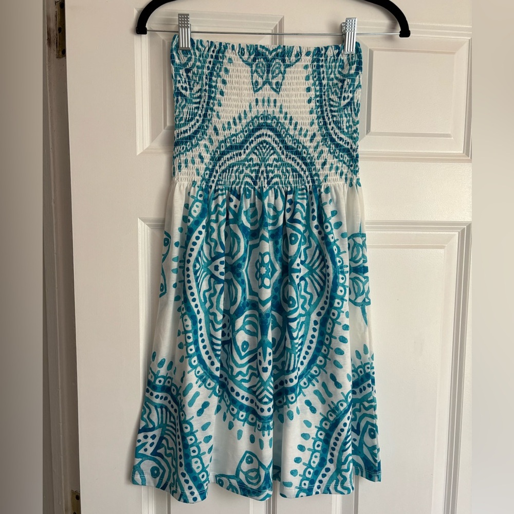 New Woman’s beach cover up.